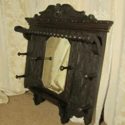 Unknown A Victorian Carved Oak Hall Mirror With Hat And Coat Hooks -Storage Furniture Sales 2024 a victorian carved oak hall mirror with hat and coat hooks sku24319099 0 2