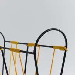 Vintage Black And Yellow Metal And Plastic Magazine Rack -Storage Furniture Sales 2024 vintage black and yellow metal and plastic magazine rack sku86377129 0 1